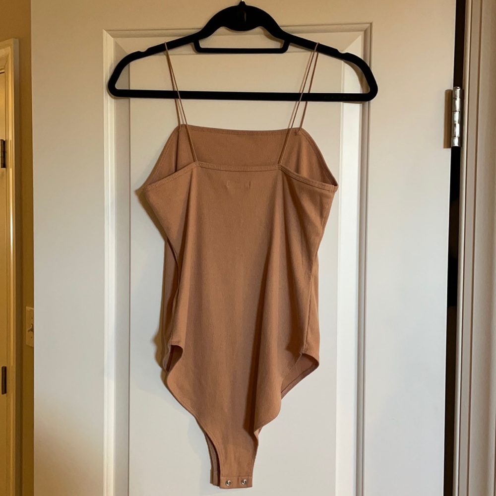 tan/neutral body suit